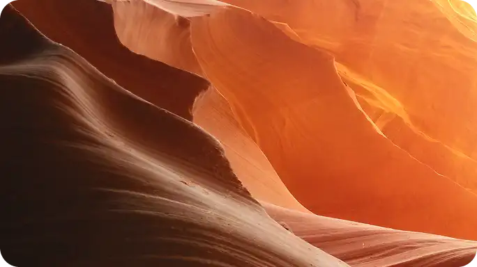 Person holding a smartphone displaying a lock icon on a white screen.