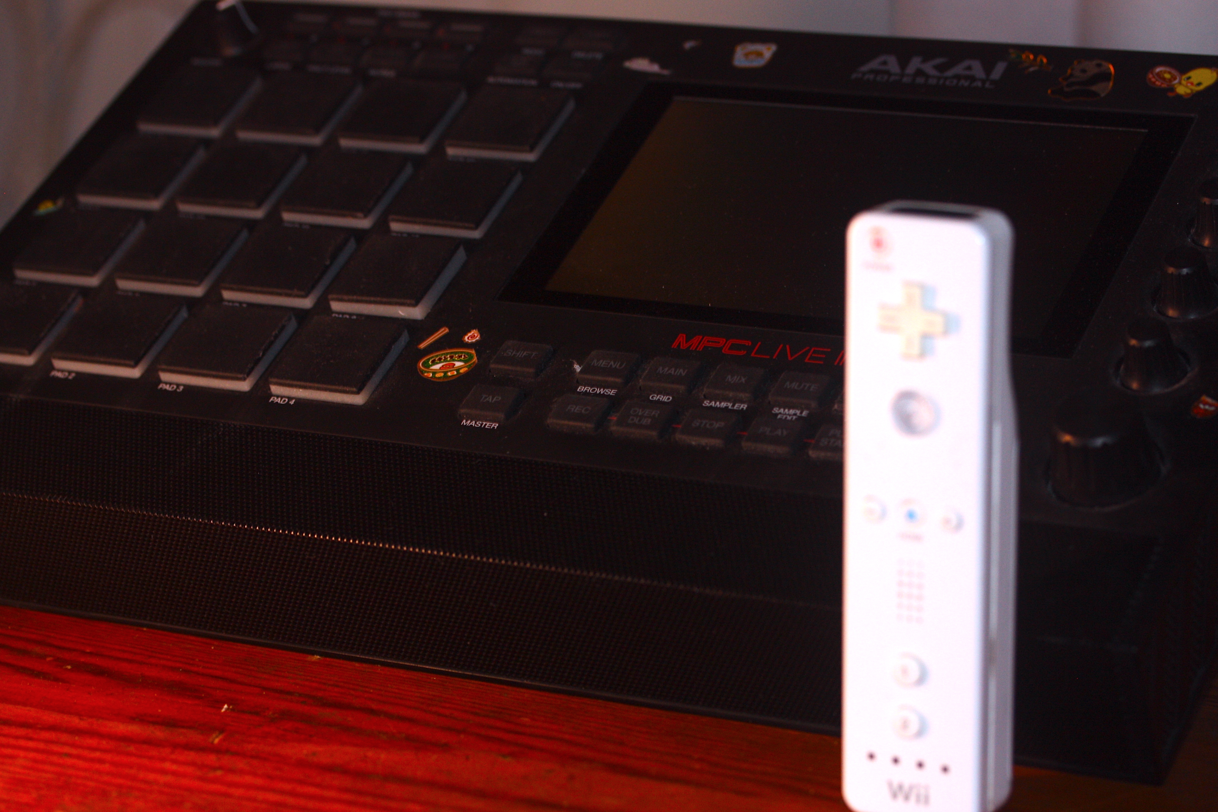 An MPC sampler and a nintendo wii controller