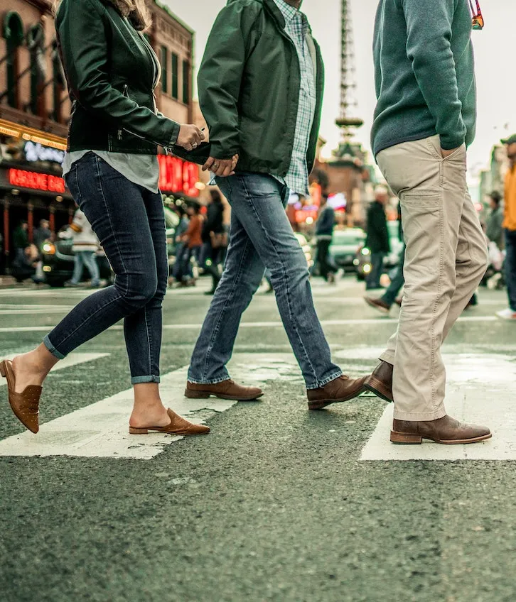 Pedestrians crossing at a city crosswalk