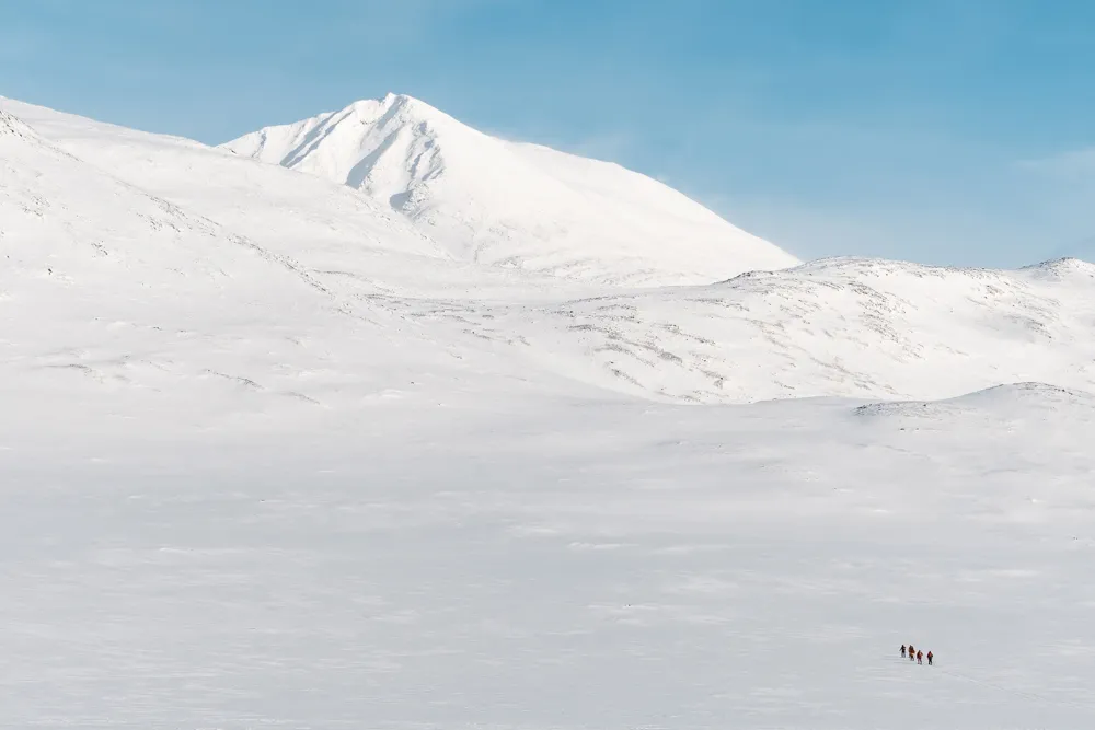 Group heading towards mountain peak in Sarek