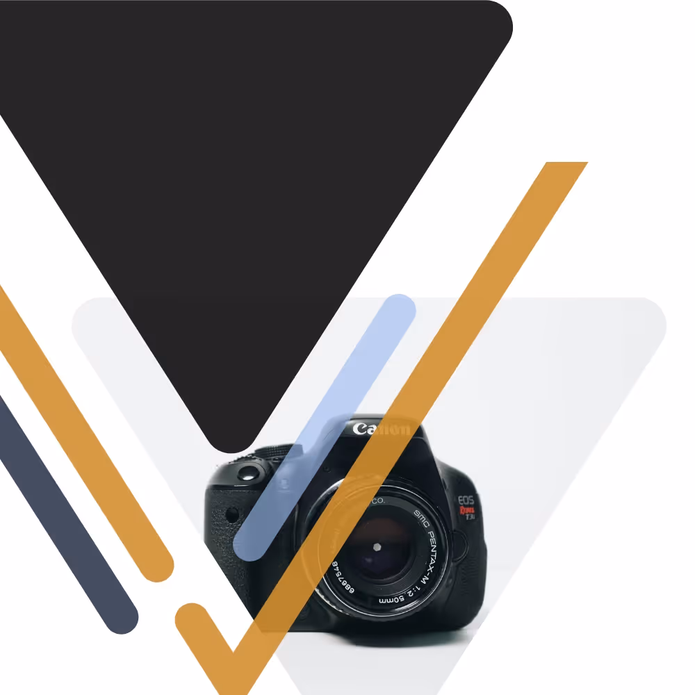 Smiling woman holding a glass of white wine, wearing a sleeveless top and glasses on her head.