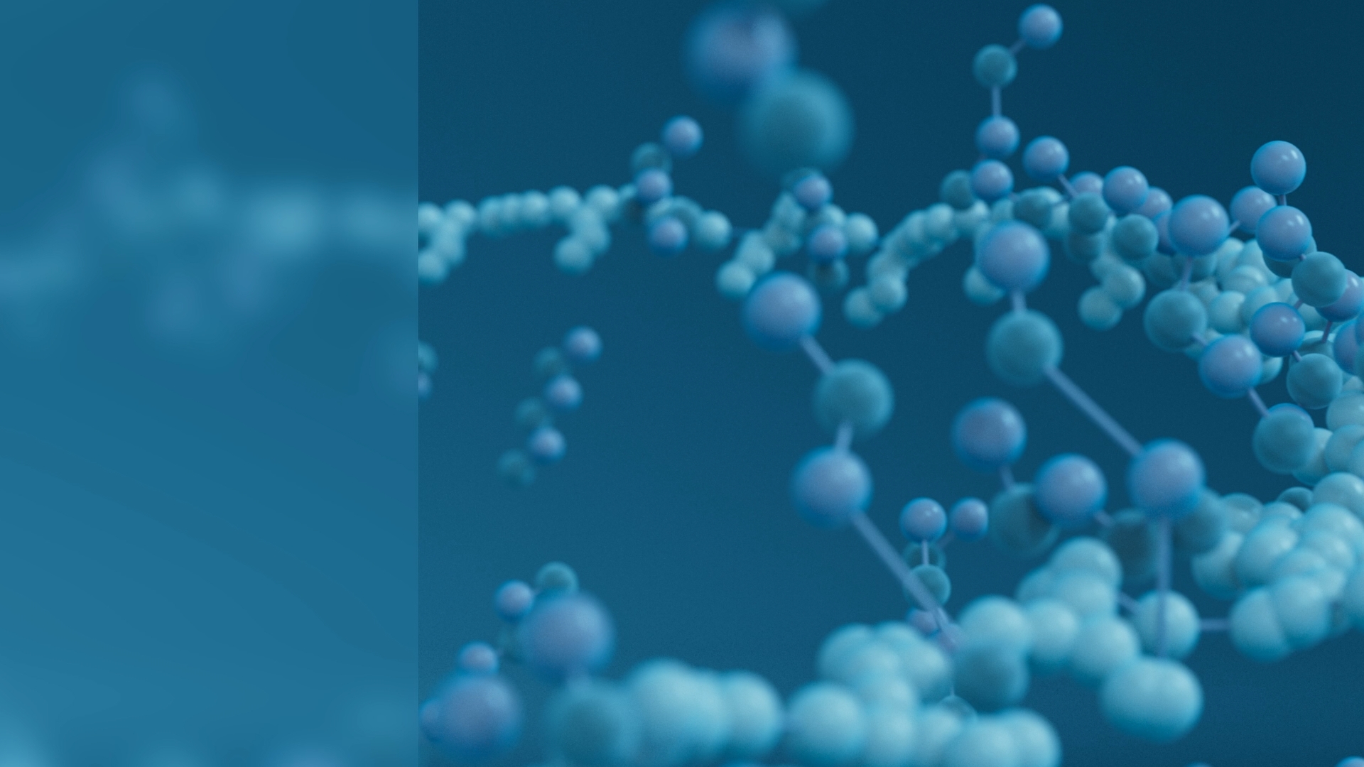 Close-up of several textured chromosomes floating in a dark blue background with light particles.