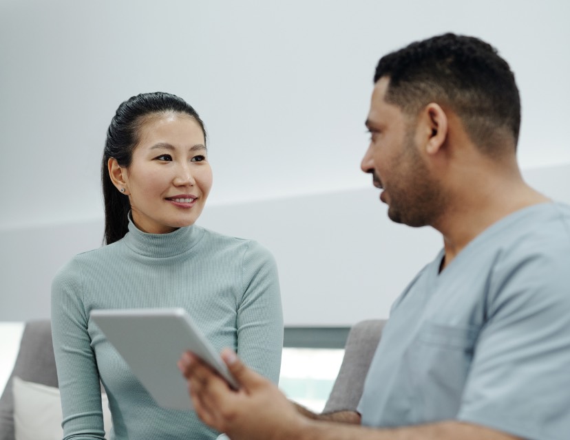 Dentist discussing treatment options with a patient during a consultation