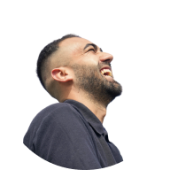 Person laughing with head tilted back, wearing dark gray shirt