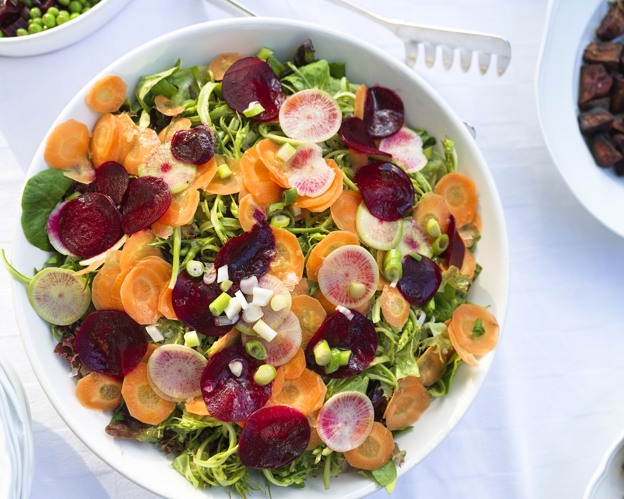 a girl sitting near tent
