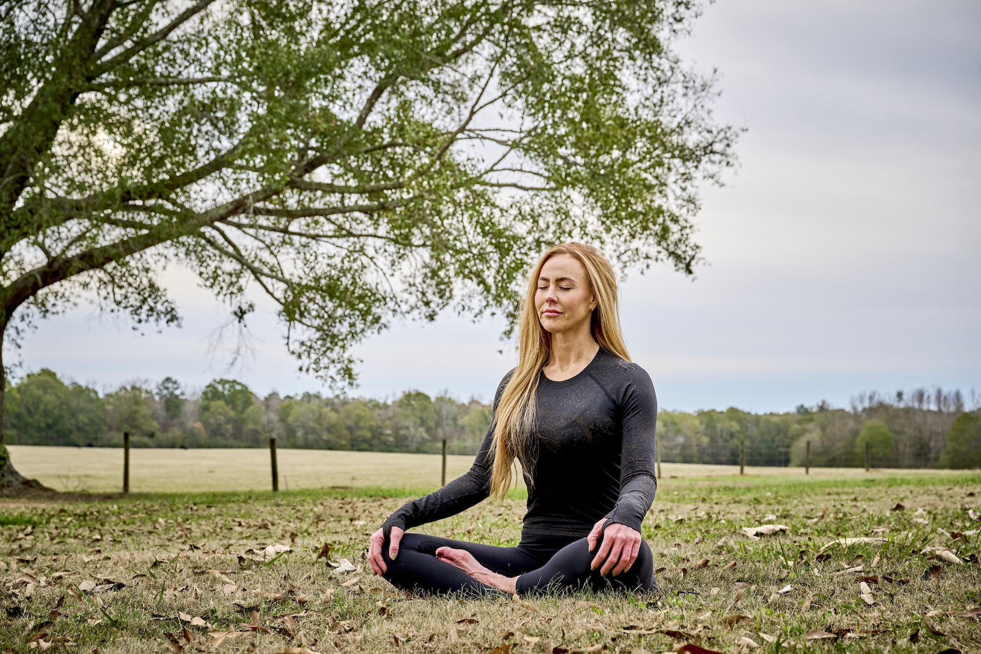 a girl sitting near tent