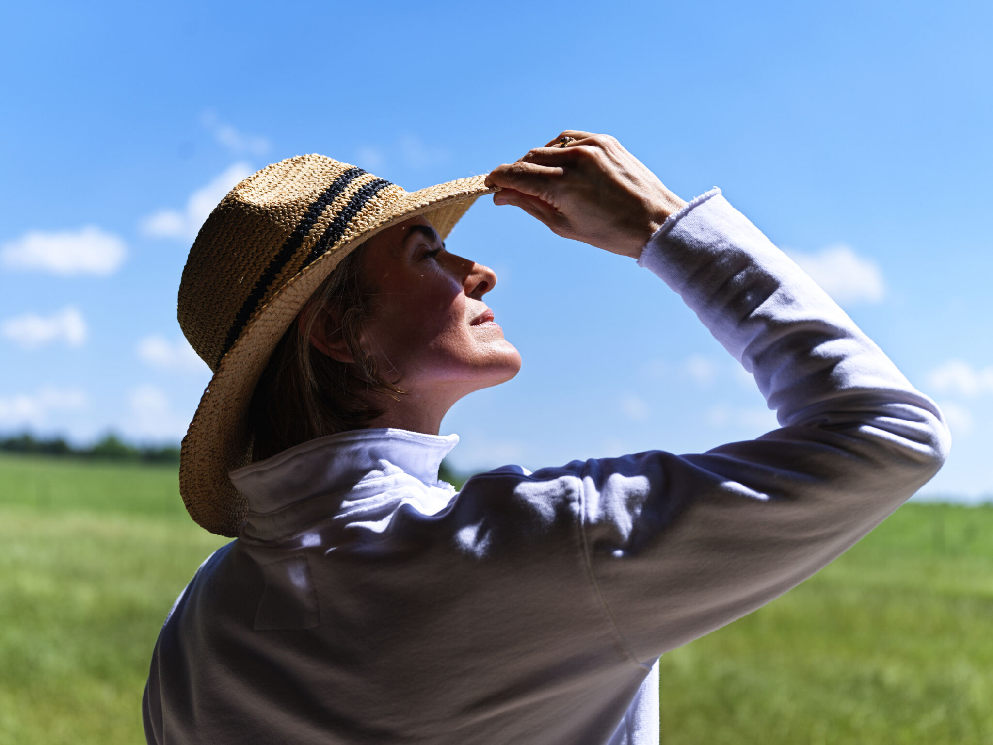 a girl sitting near tent