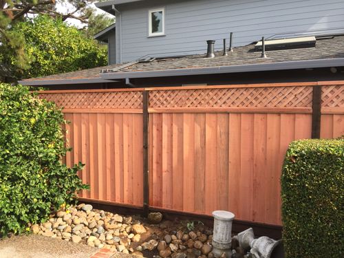 top triple lattice on top of 6 ft fence