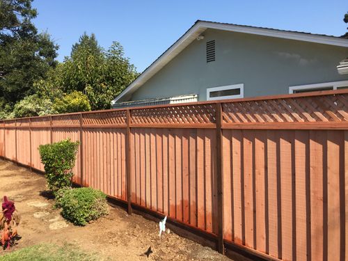 Construction common redwood 6 ft louvered fence with 1 ft of triple Diagonal lattice