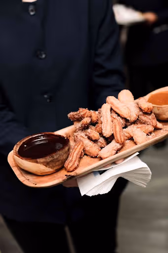 churros with dip being served