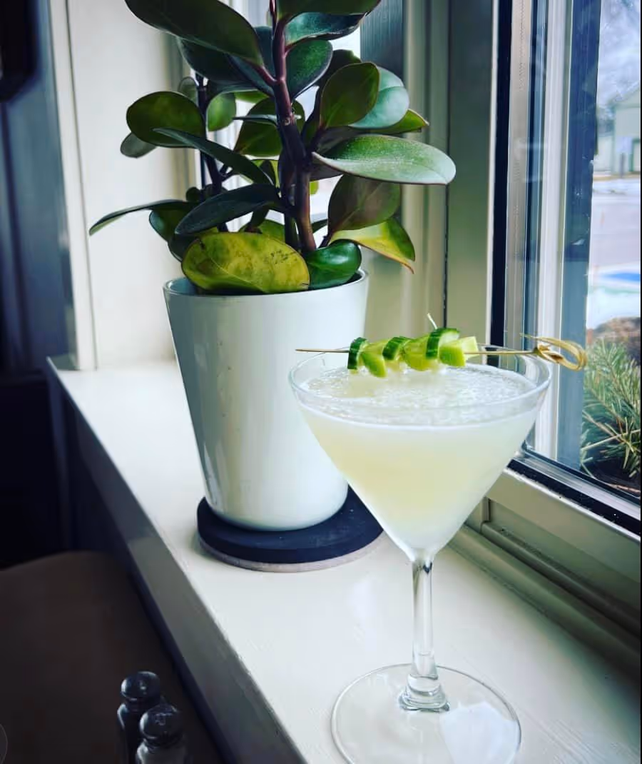 cocktail drink placed near the window