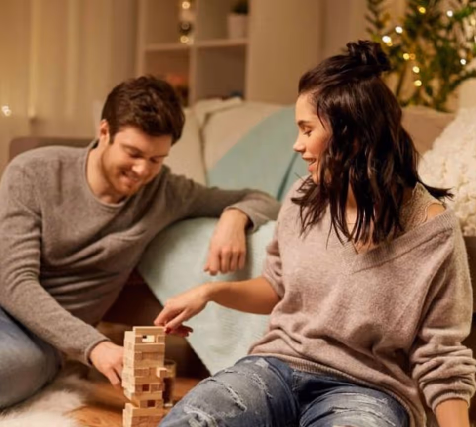 a couple playing board games together for date night