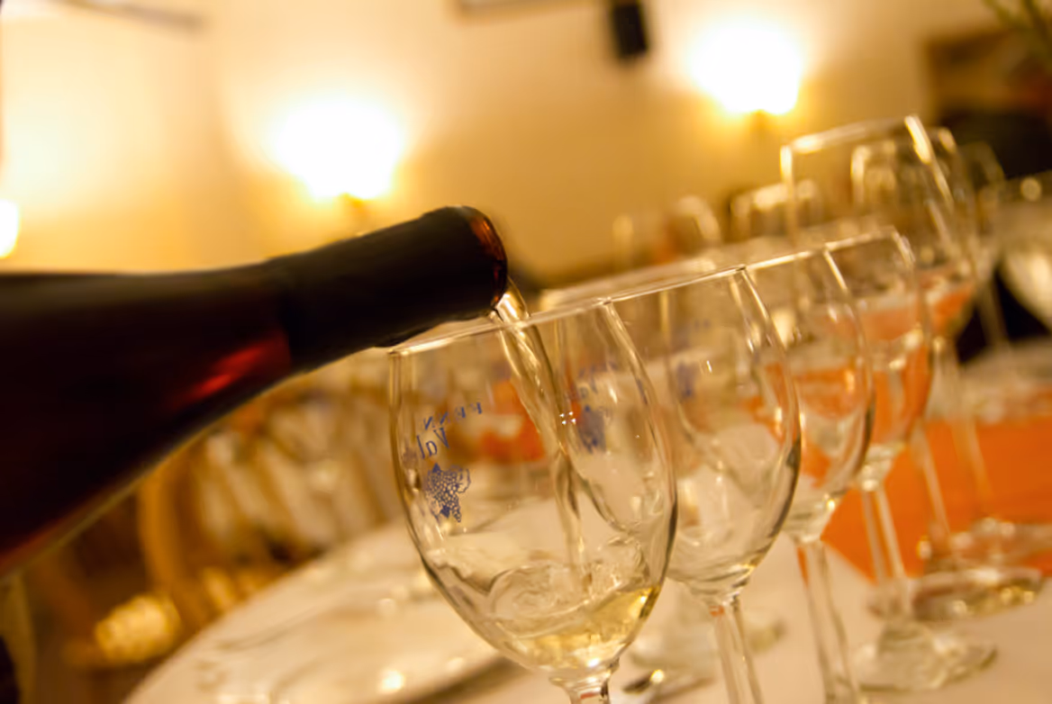 wine being poured at a wine tasting during a cold couples date night