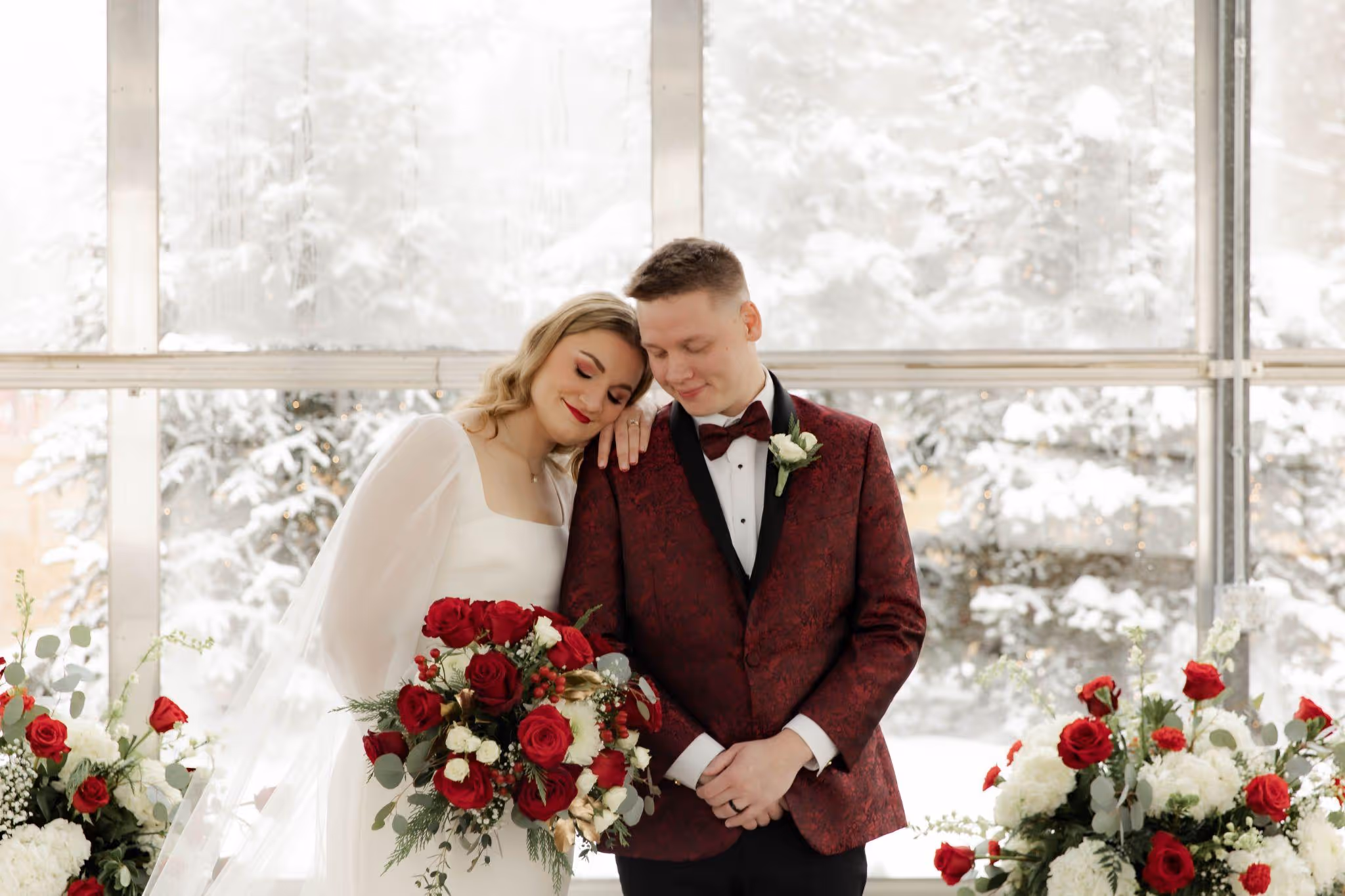 Charles and James with red roses floral arrangements
