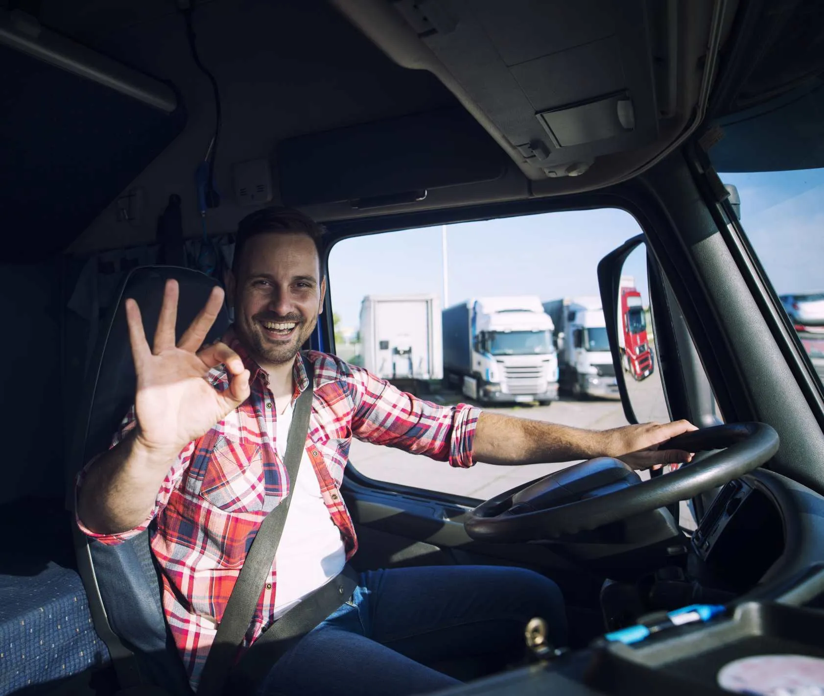 Truck driver showing excitement in his truck