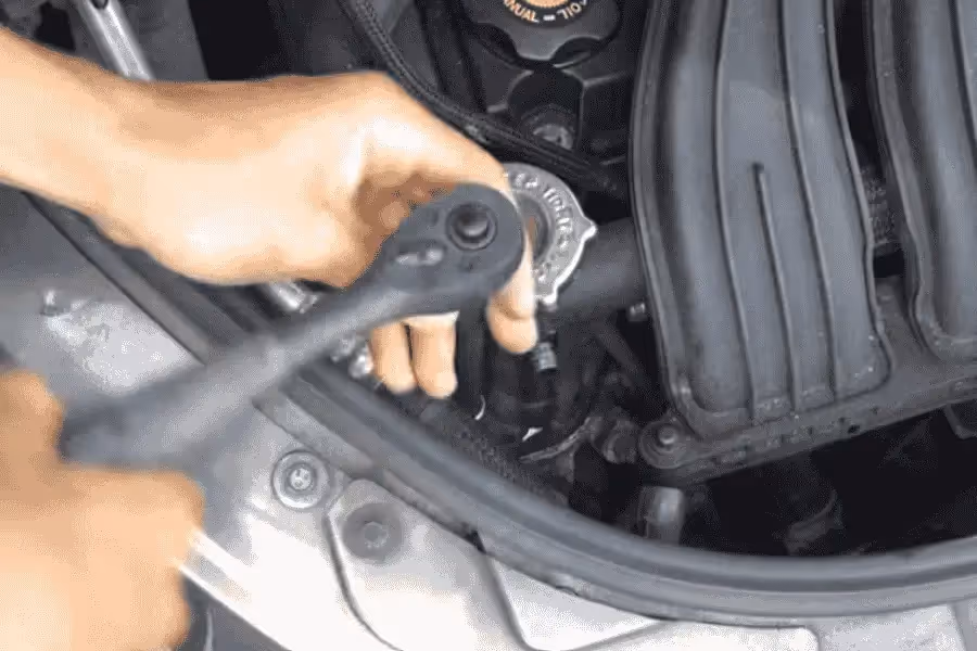 thermostat replacement removing the bolts holding the housing