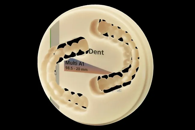 Circular dental mold with an arch of teeth impressions labeled 'Multi A1 98.5-20 mm'.