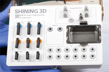 SHINING 3D high-accuracy coded scan kit with screws, torque ratchet, and spare parts on a tray.