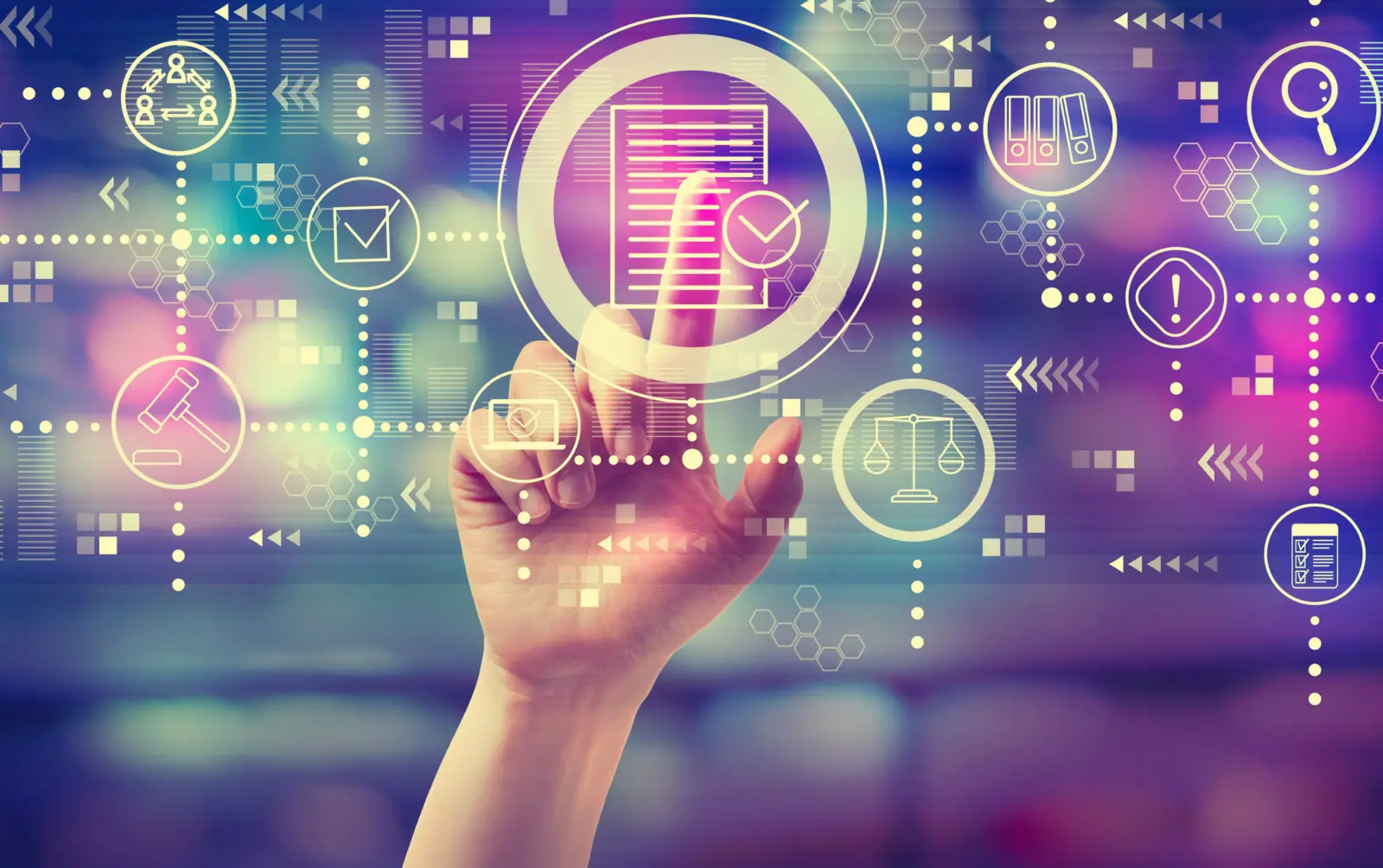 Finger pointing to data on a futuristic screen