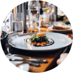Restaurant table with plate of food, image