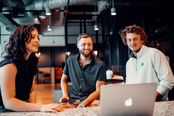 Three people working together