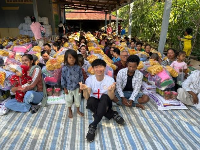 A group of people sitting on a blanketAI-generated content may be incorrect.