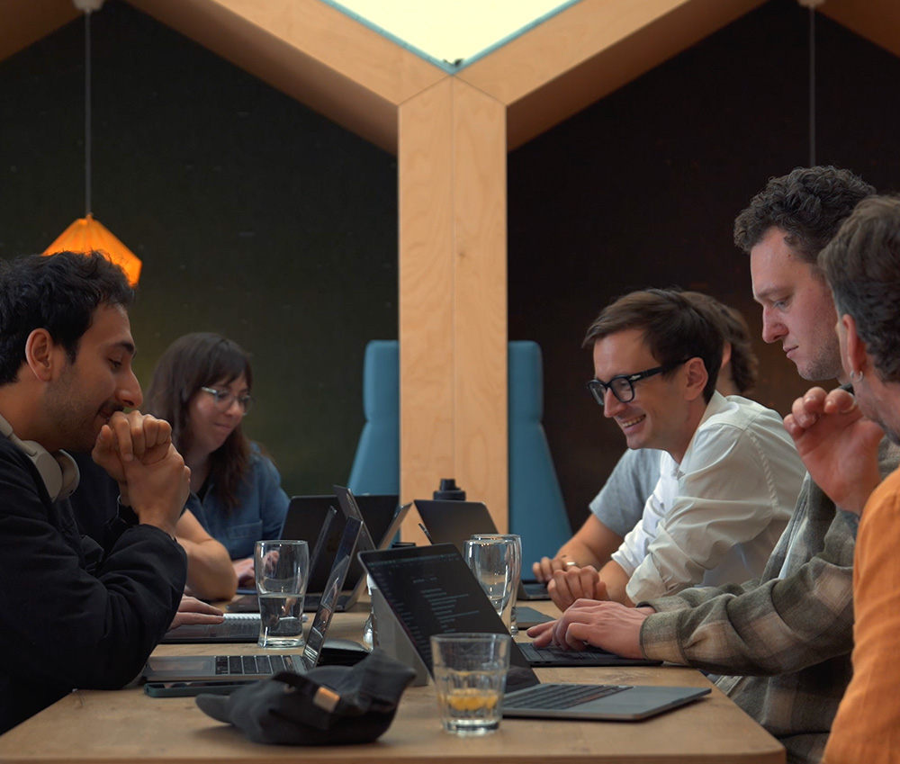 A group of people working on laptops