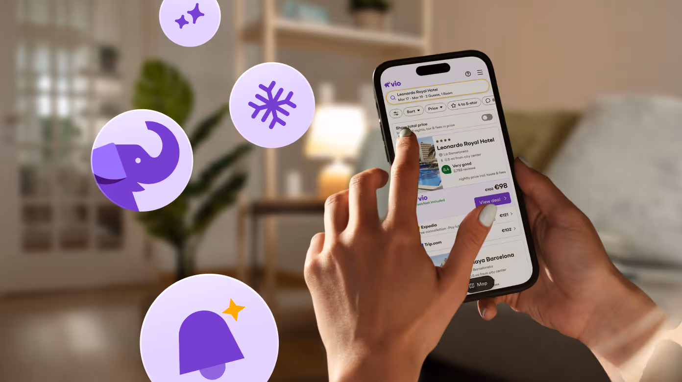 User selecting hotel deals in the Vio mobile app on a smartphone at home