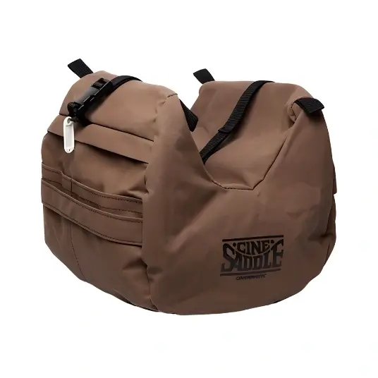 Brown CineSaddle padded camera mount bag with multiple straps and compartments.