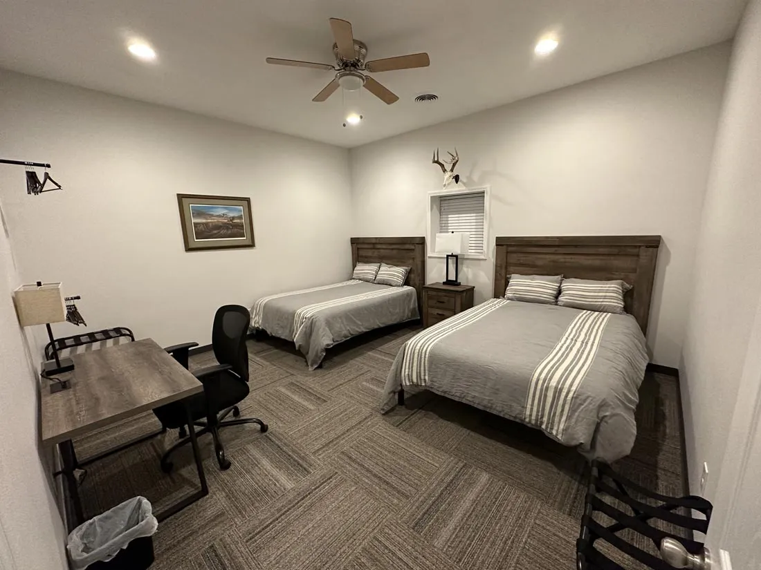 guest bedroom with 2 beds