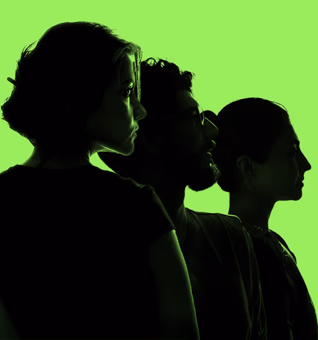 People in a line with a green background