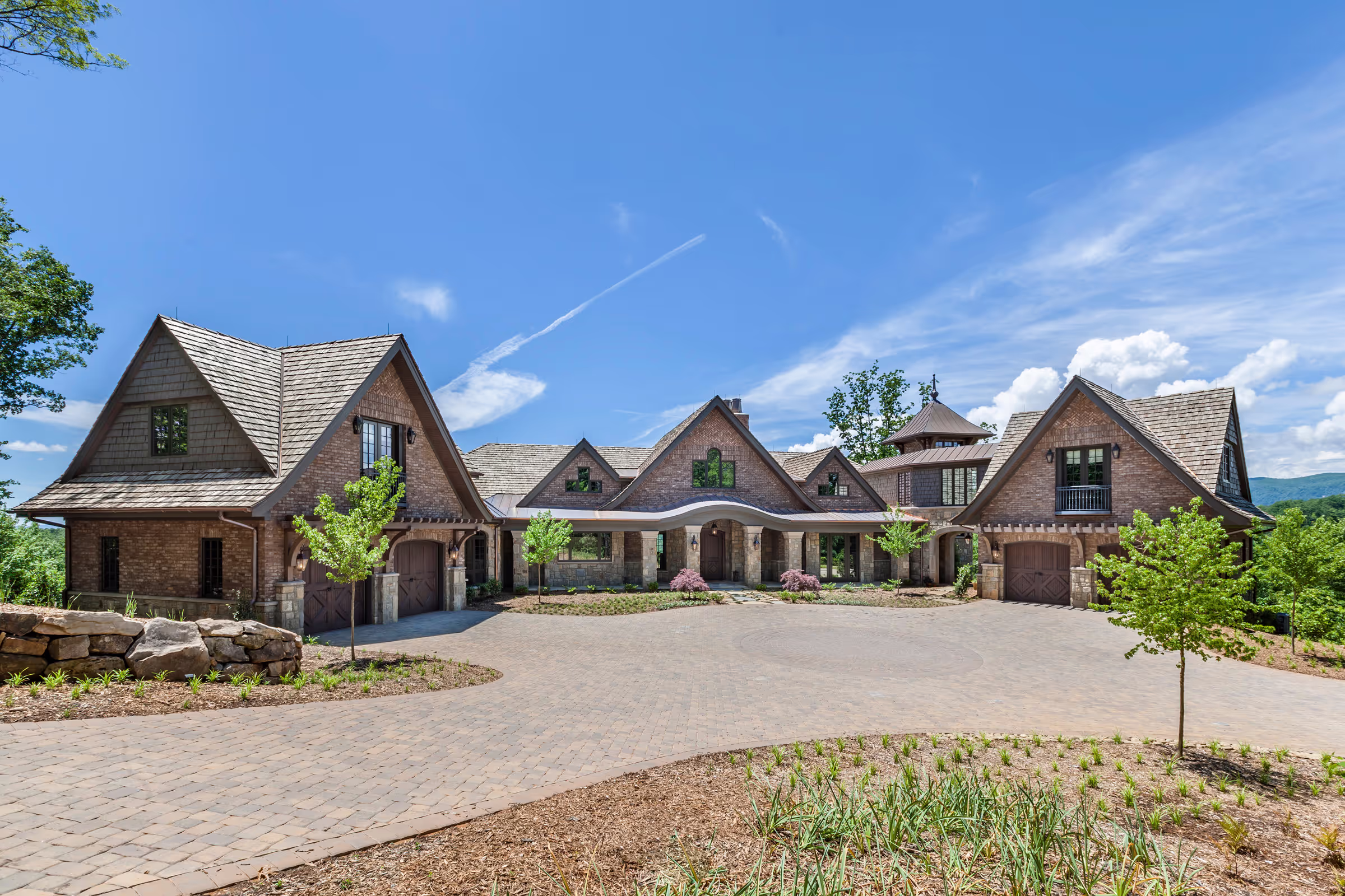 Exterior of a luxury custom home built by Fairview Custom Homes – stone and timber mountain home South Carolina