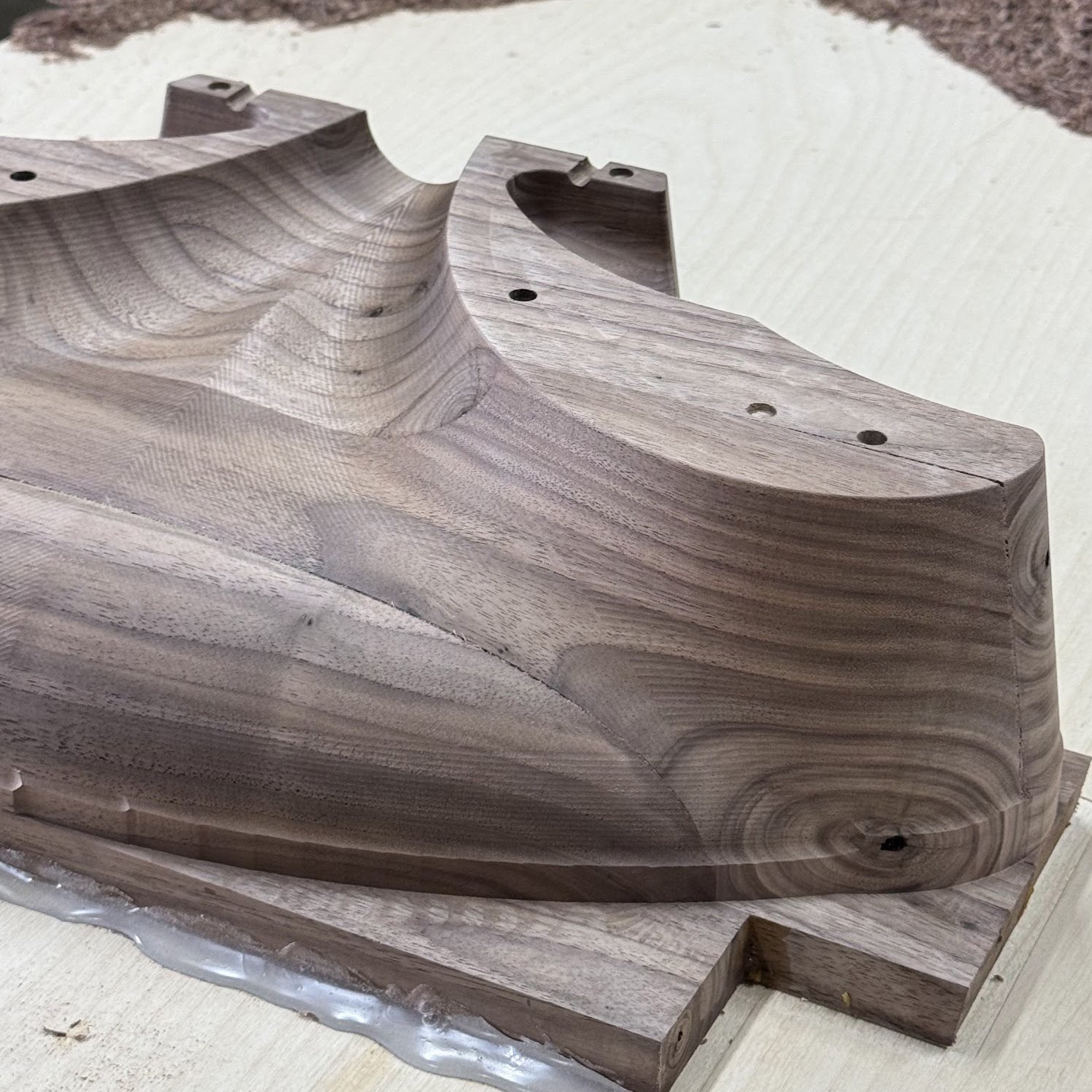 Carved walnut sculptural form fresh off the machine