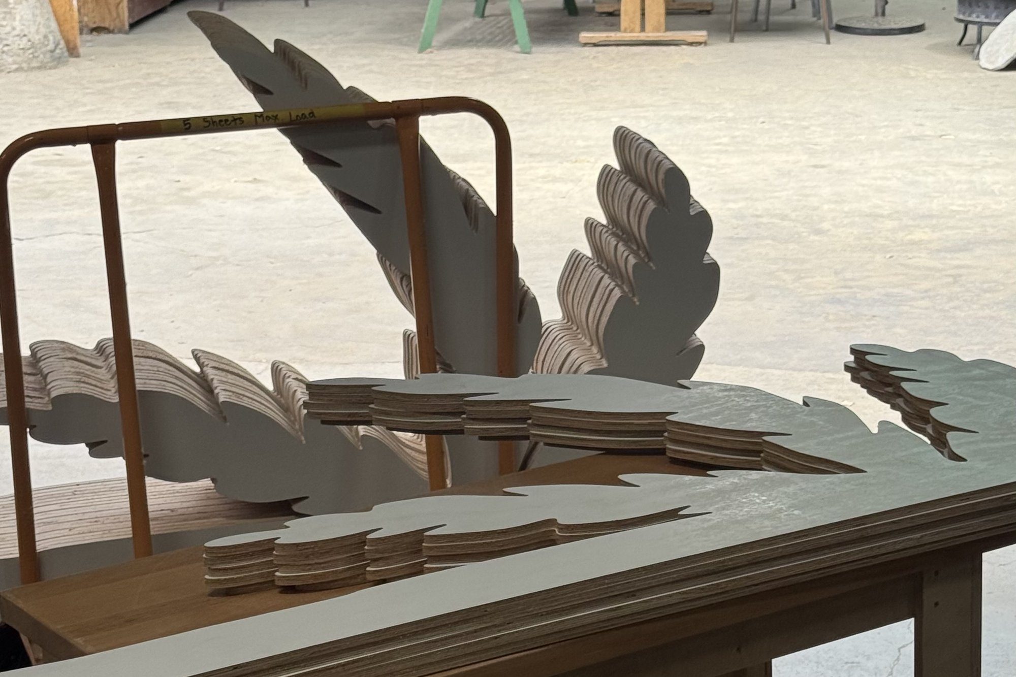 Stacked palm frond cutouts for a themed environment
