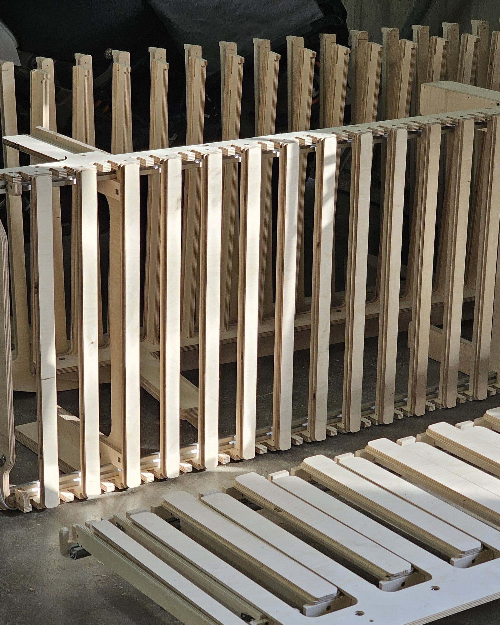 Slatted wood panel frames staged in the shop