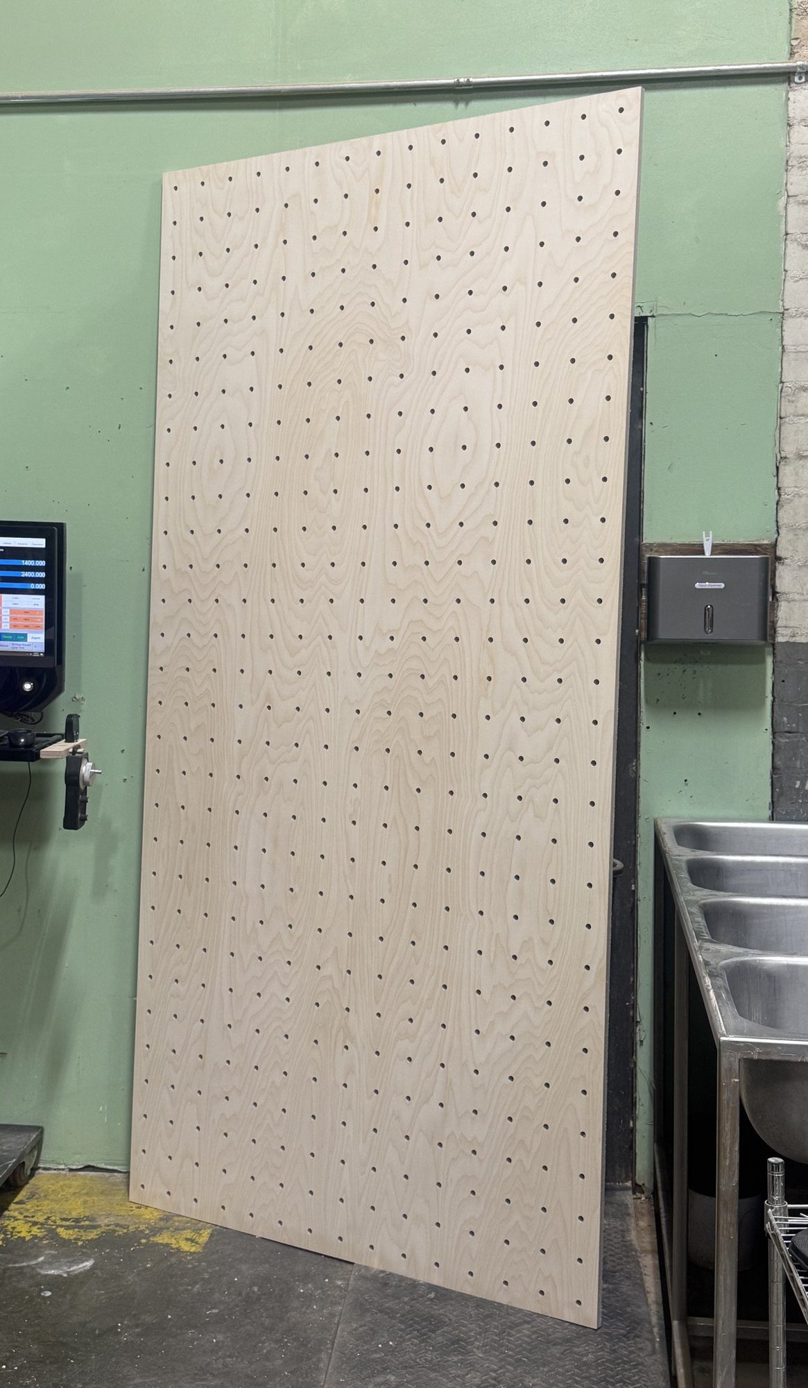 Perforated birch plywood panel ready for delivery