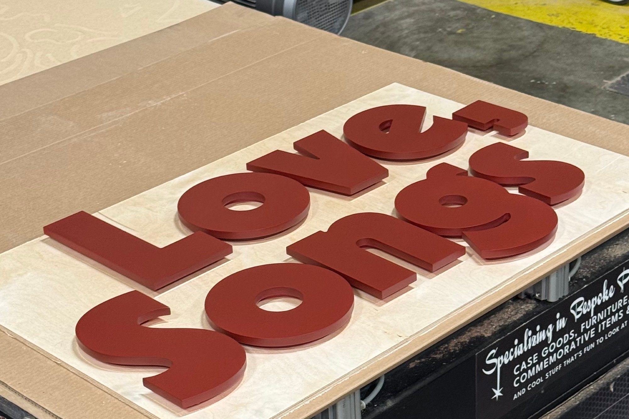 Red dimensional letters for a sign on the router bed