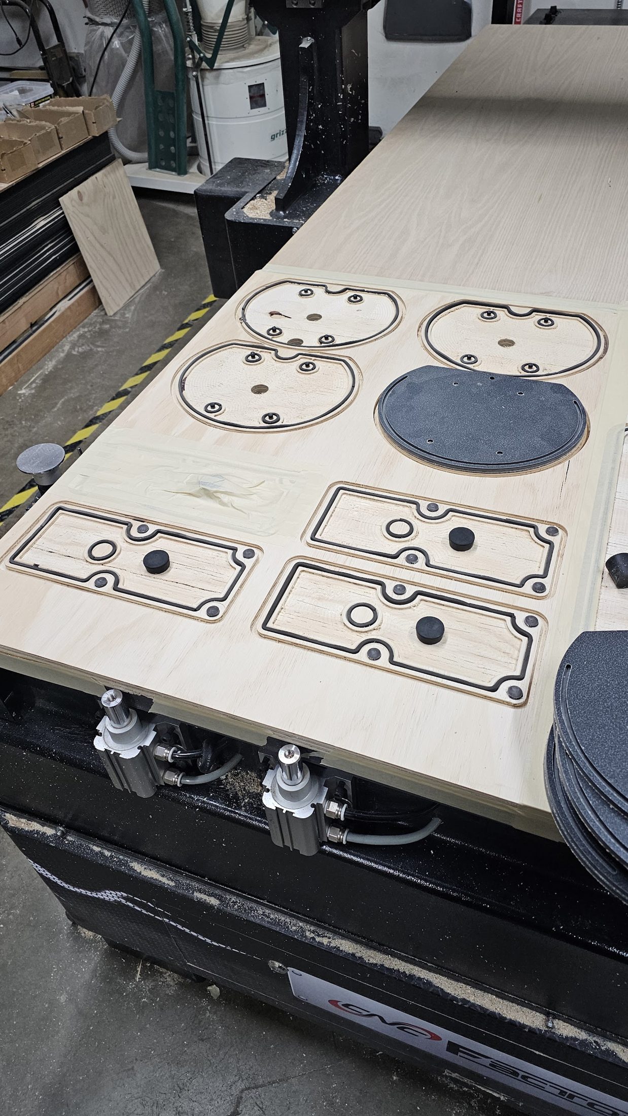 Routed parts with circular cutouts on the router bed