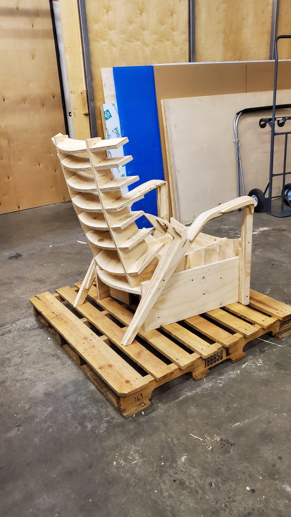 Curved plywood lounge frame on a pallet