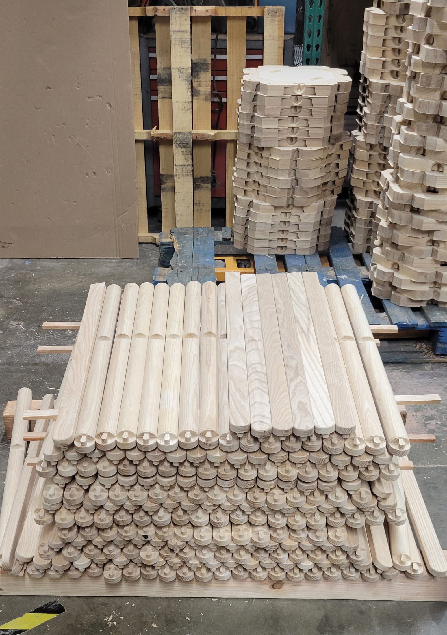 Bundles of turned wood dowels on pallets