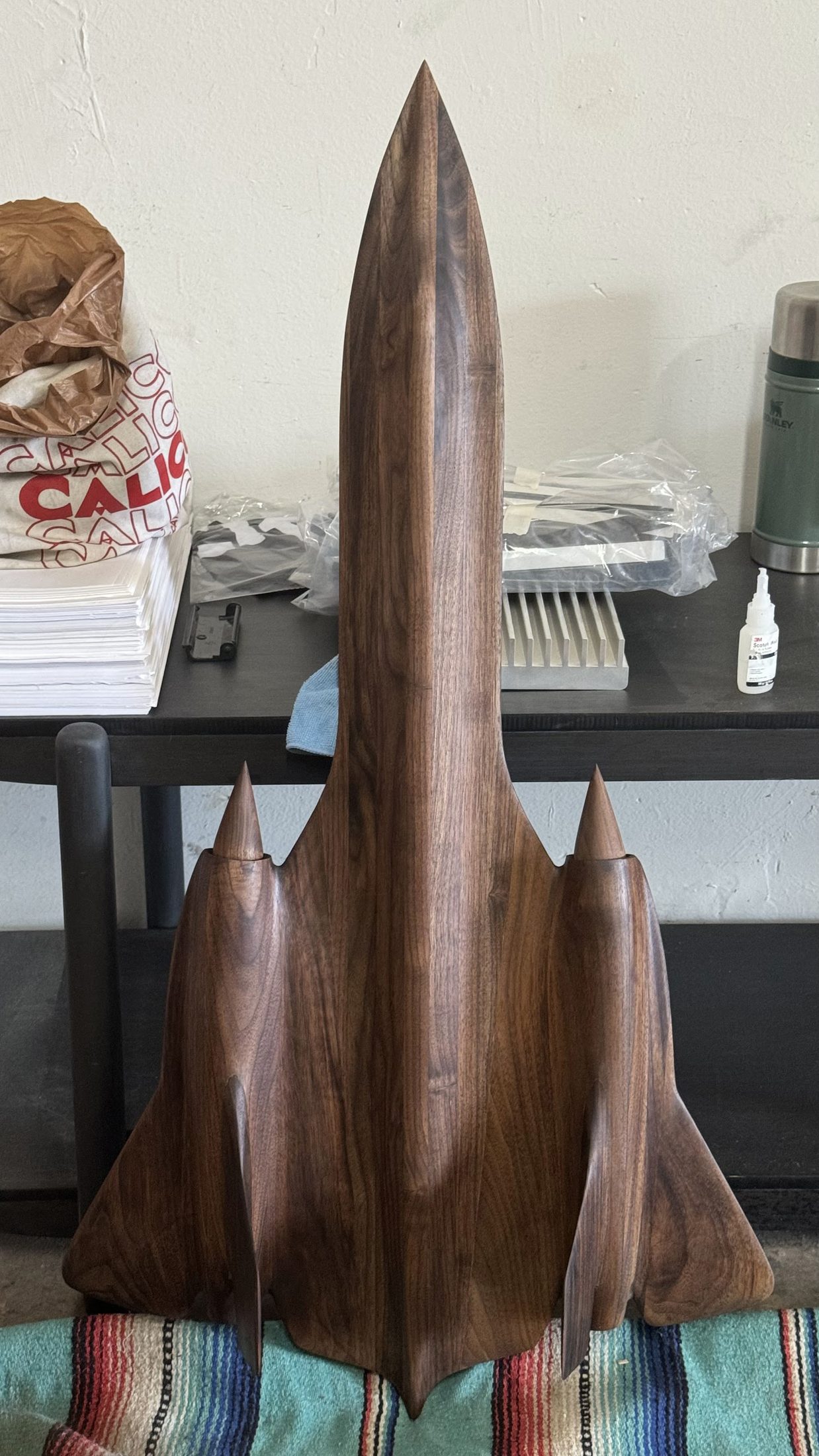 Carved walnut aircraft model standing upright