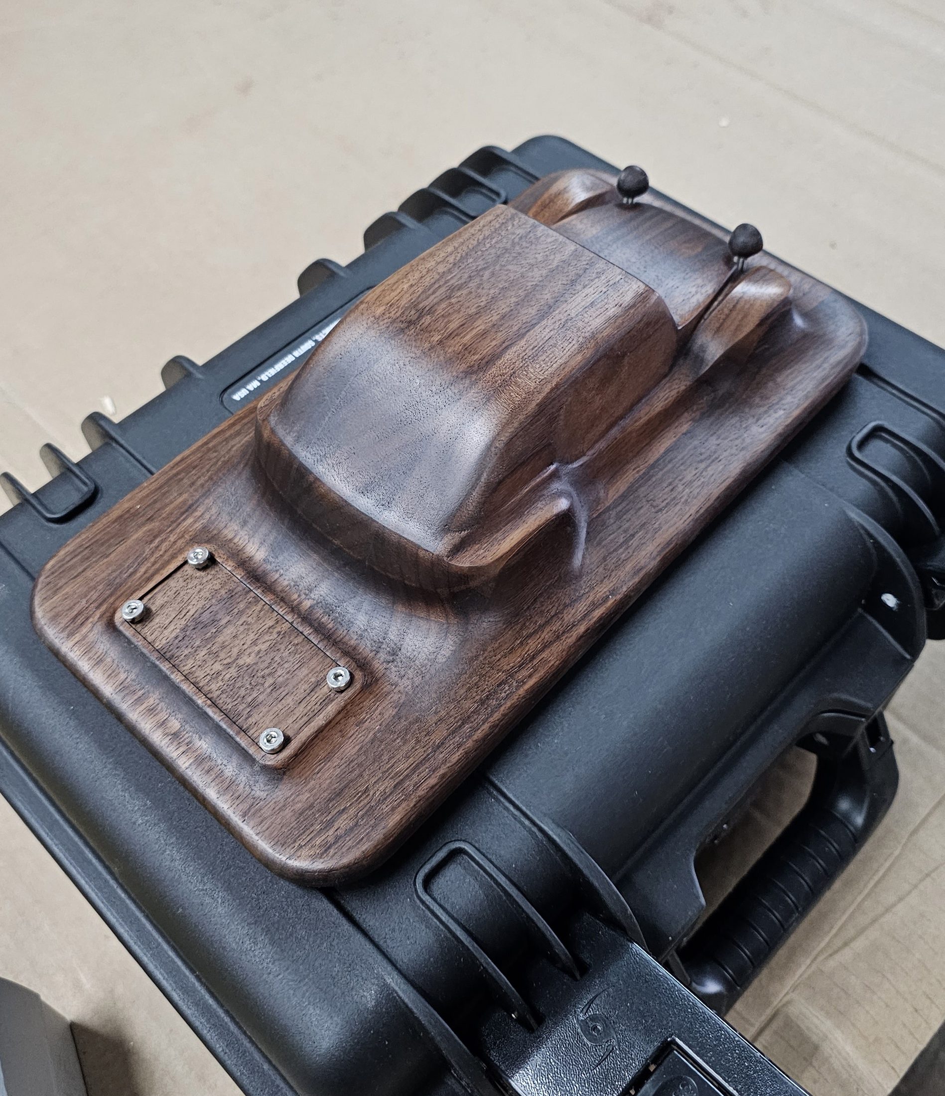 Carved walnut car model in a fitted case