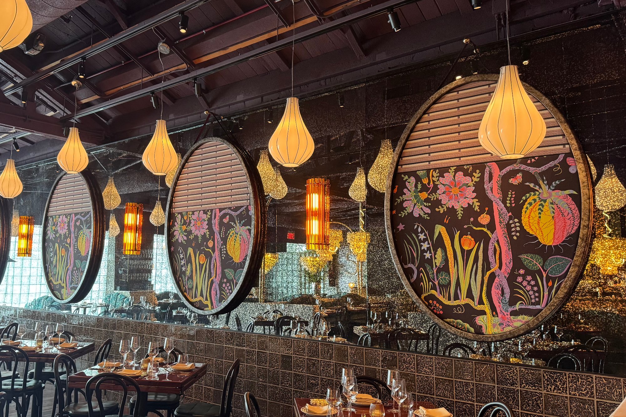 Restaurant dining room with painted floral oval panels and decorative finishes
