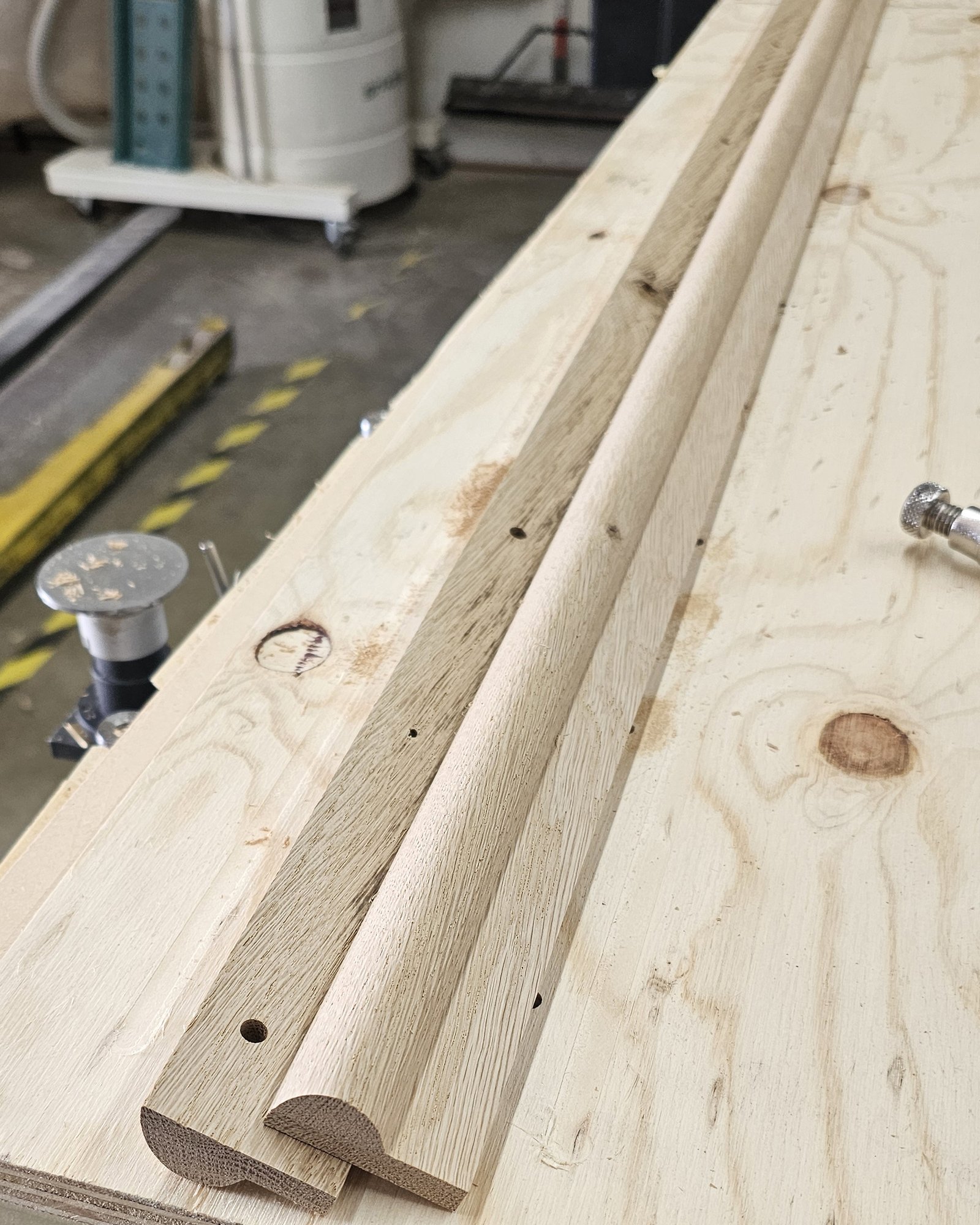 Solid oak molding profiles routed on a plywood fixture