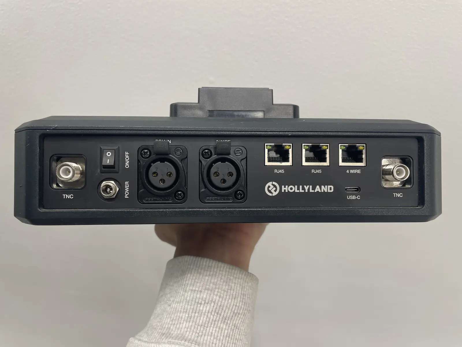 Rear panel of the Hollyland Solidcom C1 Pro hub showing the RJ45 ports used to link multiple hubs together