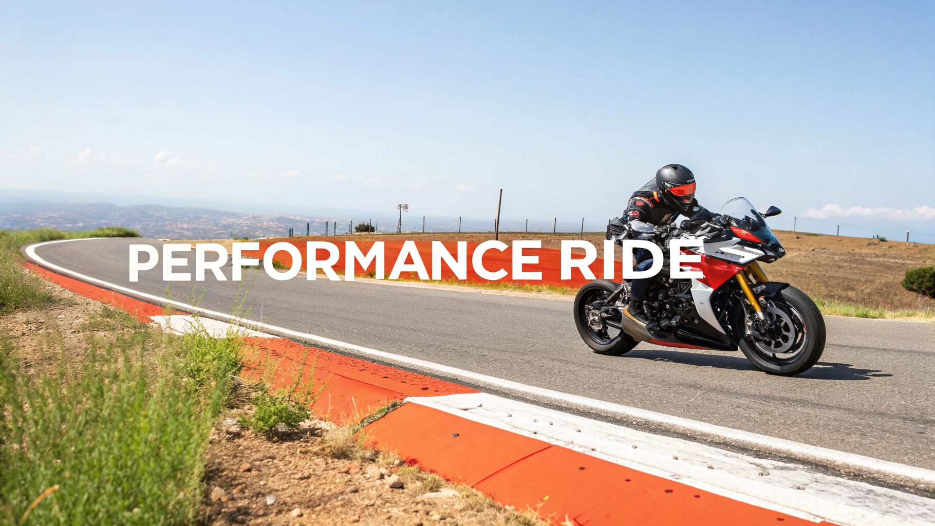 A rider on a red and white performance motorcycle leans into a turn on a scenic road.