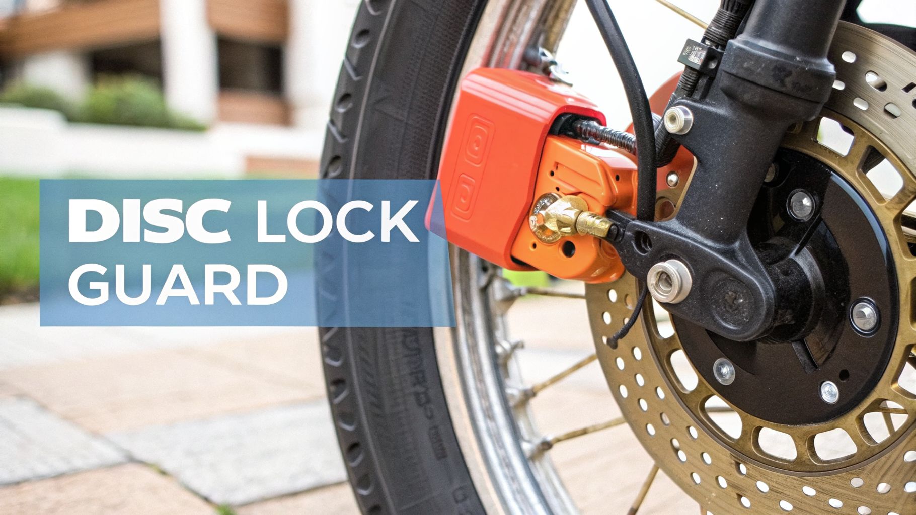 Close-up of an orange motorcycle disc lock guard securely placed on the front wheel's brake disc.