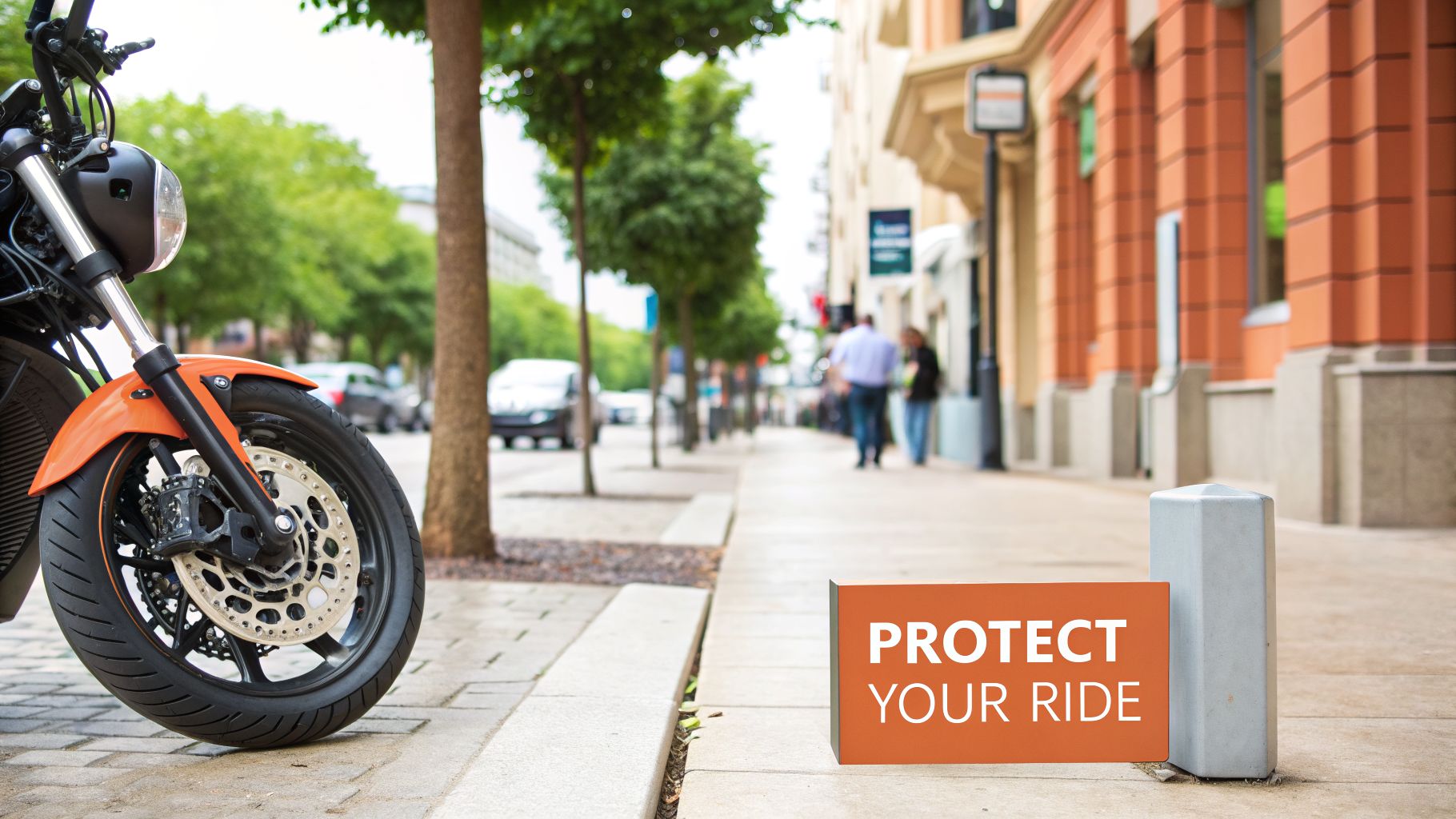 A motorcycle's front wheel with disc brake on a city sidewalk next to a 'PROTECT YOUR RIDE' sign.