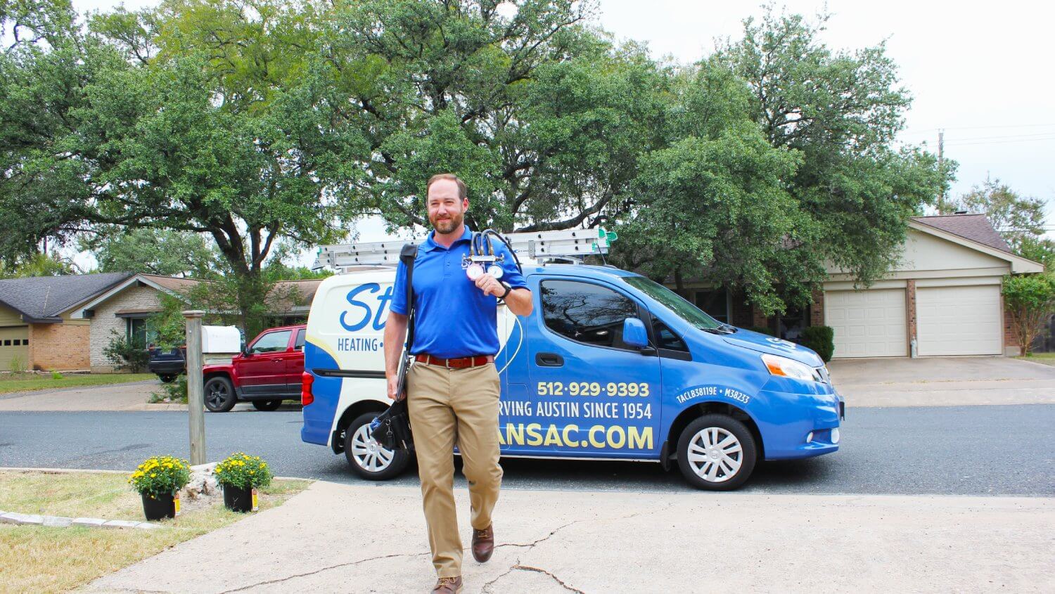 stan's technician walking in front of a stan's van