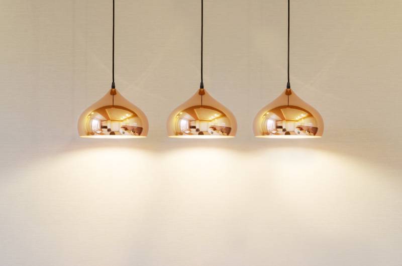 Three modern pendant light fixtures.